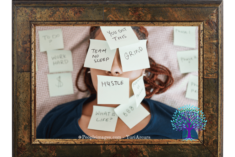 Woman laying down on floor covered in sticky notes.