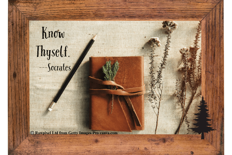 Journal and pencil with flowers and the quote know thyself by socrates.