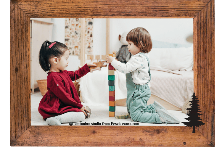 Two small kids stacking different colors of blocks.