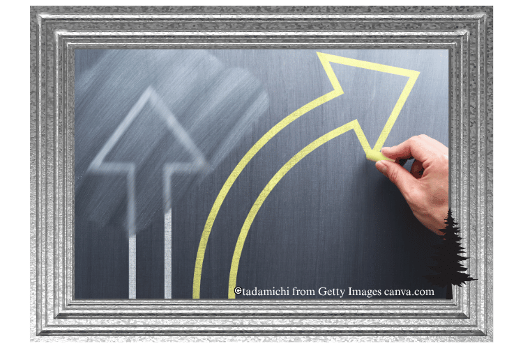 Chalkboard with two arrows, a white arrow slightly erased and a yellow arrow curving to the right.