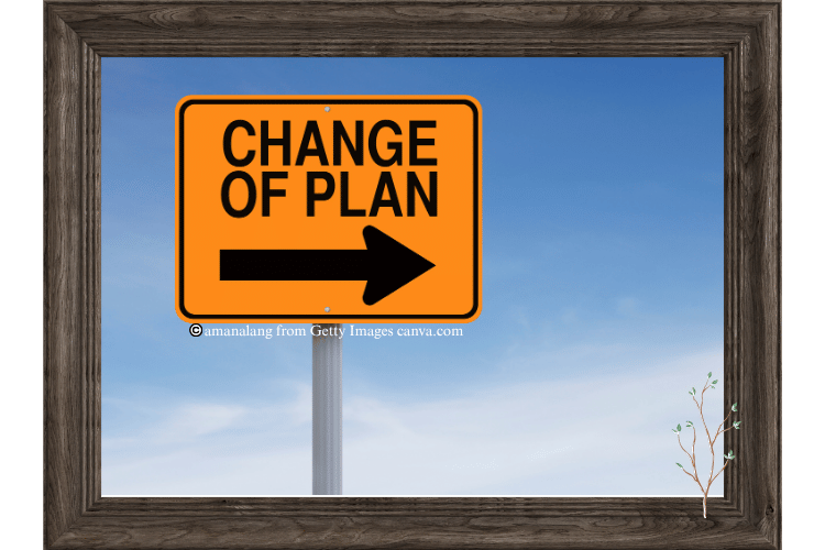 Road sign with the words change of plan